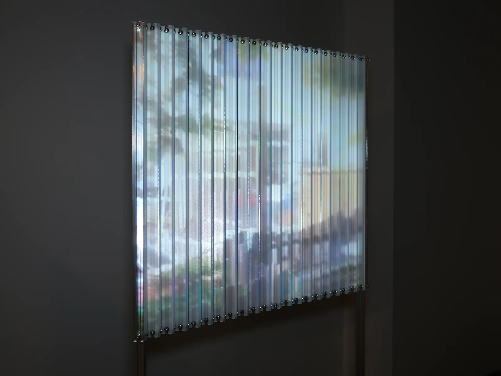 Lenticular Dream, 2023 — Aluminum, acrylic, projection 27” x 59” x (18” or 1” variable dimensions)