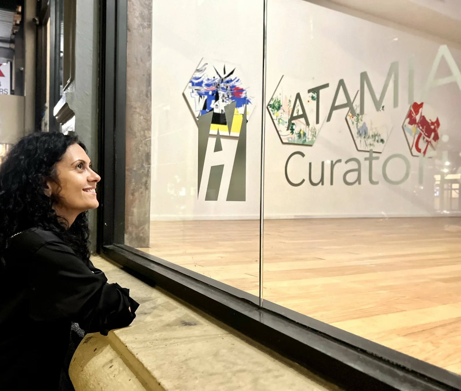 Tamar Hovsepian beside the Atamian Hovsepian gallery window.